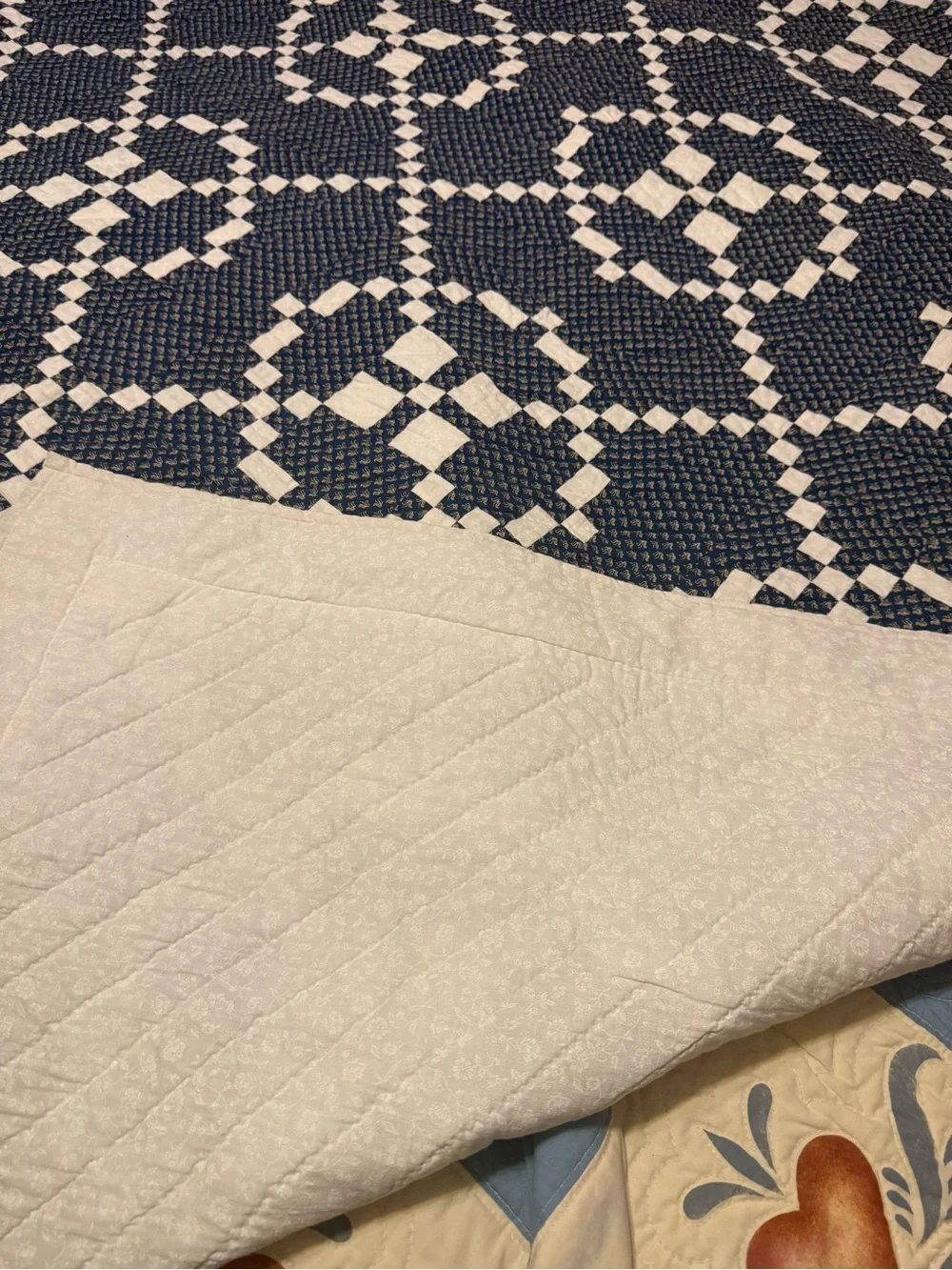 handmade patchwork quilt features the traditional Burgoyne Surrounded pattern